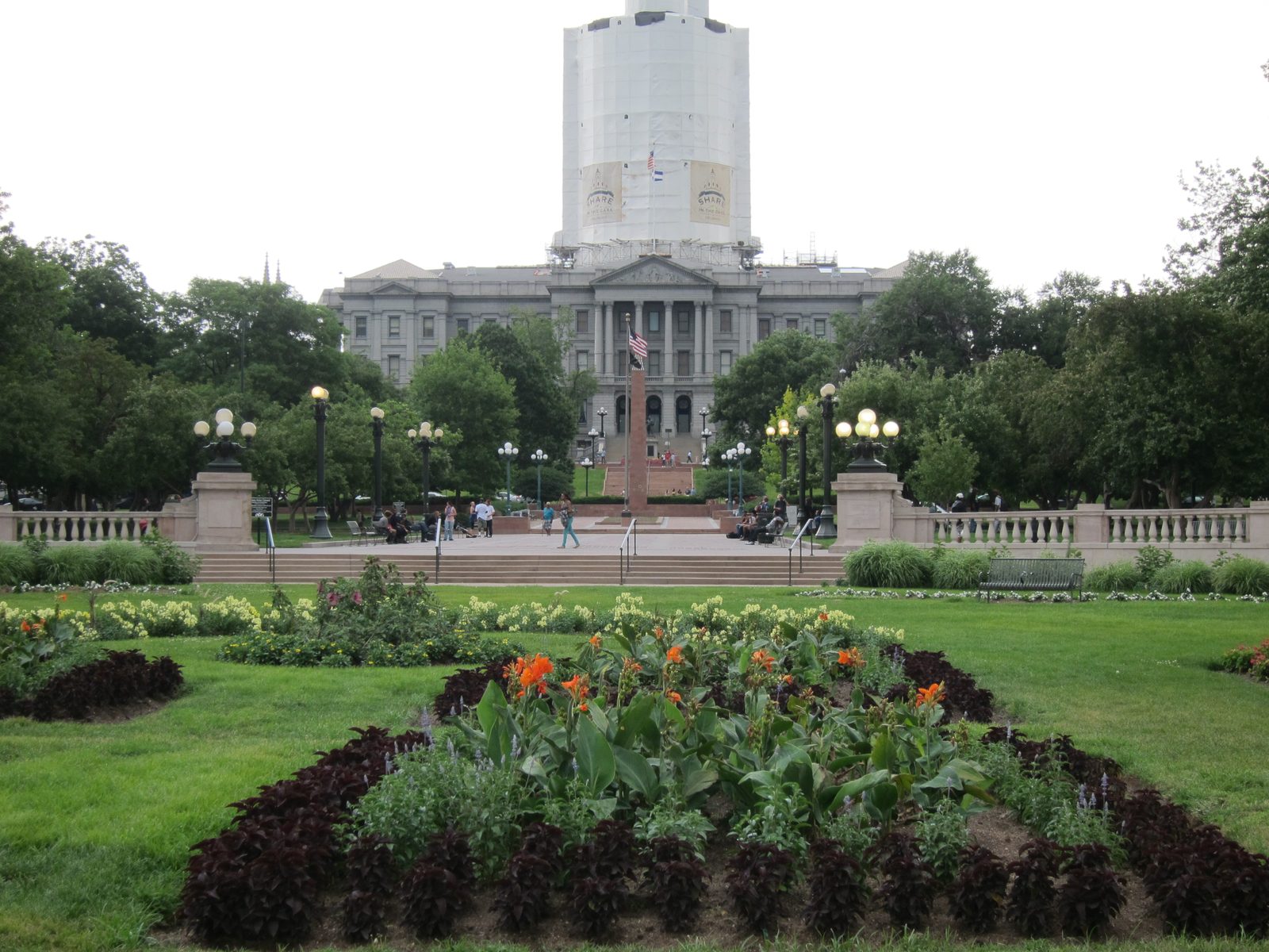 Opposite the City and County Building is the State Capitol whose dome is currently being...
